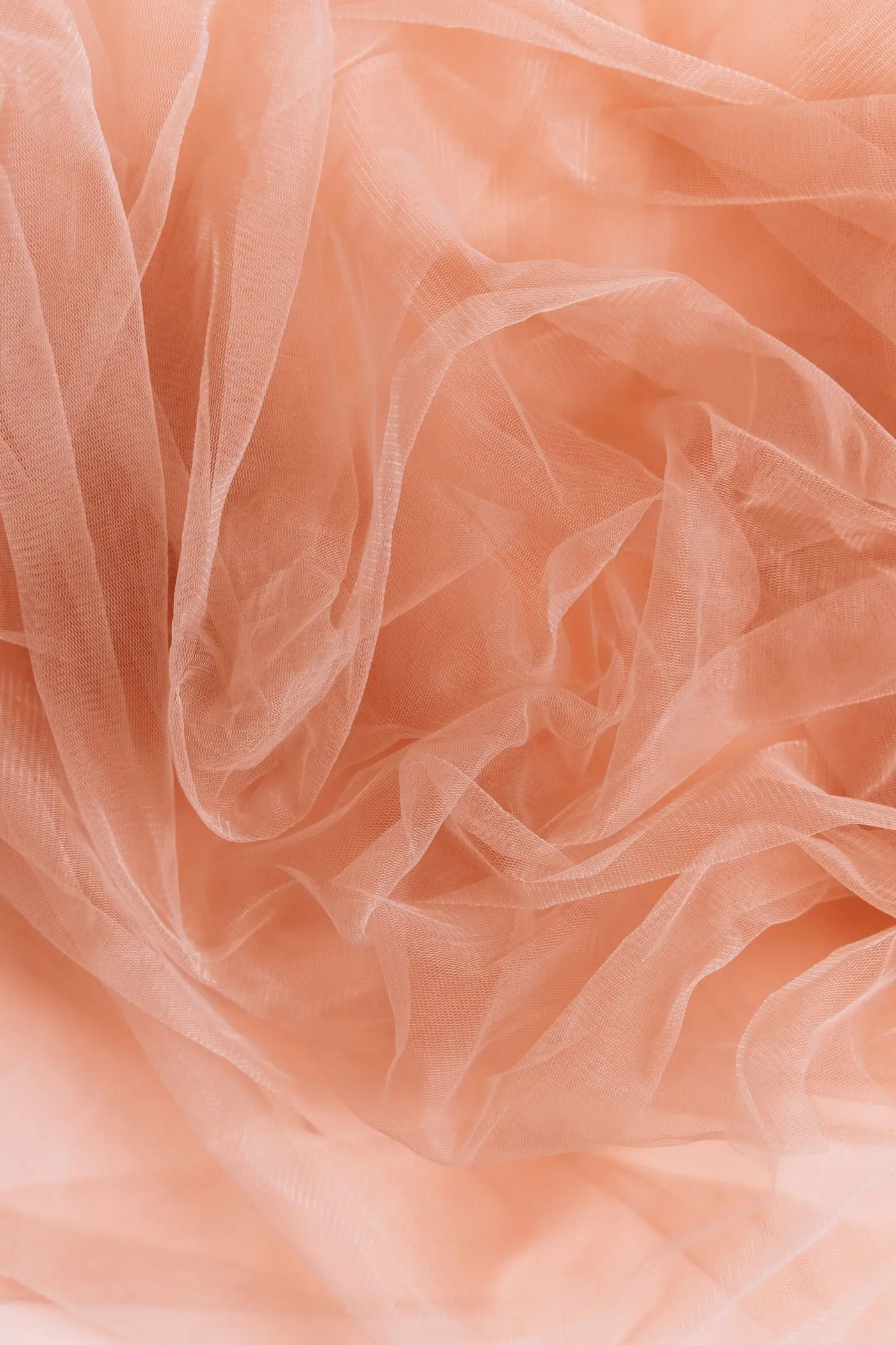 Layers of sheer, translucent fabric gathered into airy folds