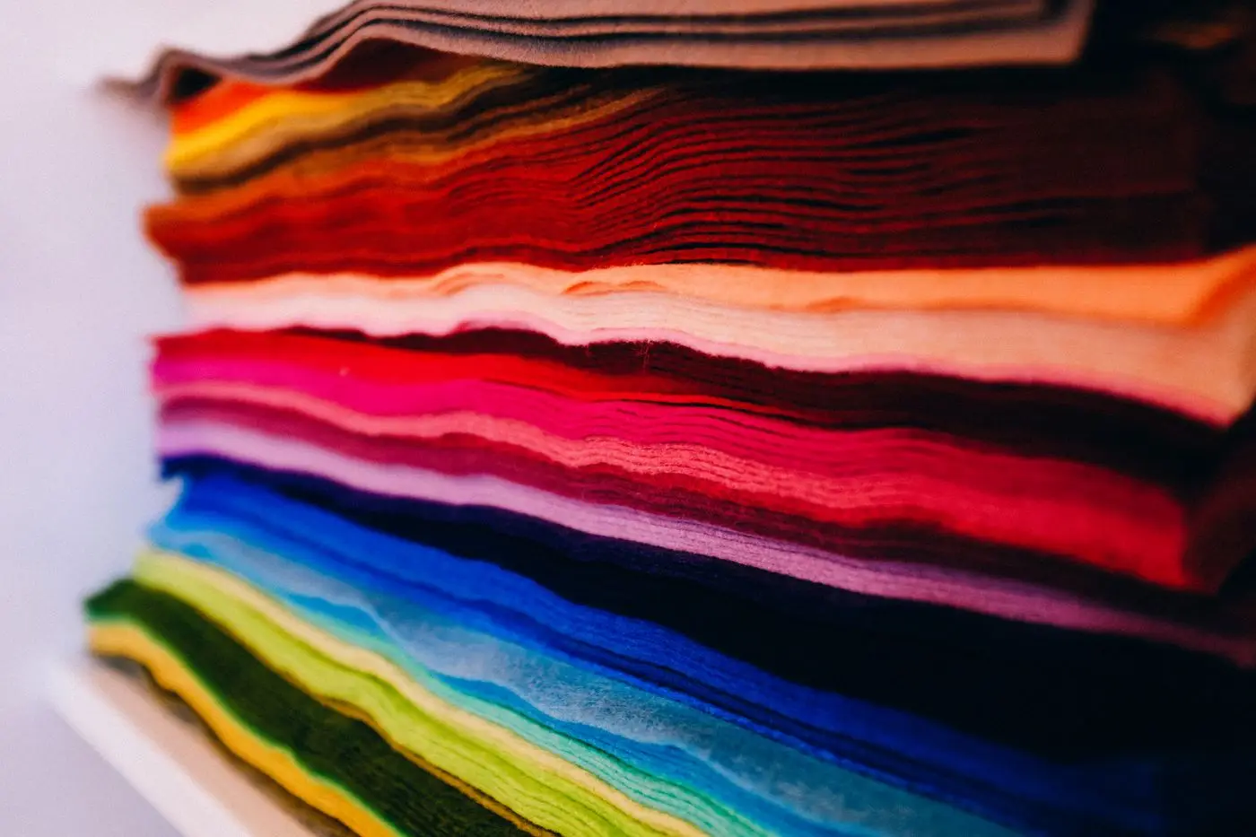 A stack of felt sheets in many bright colours