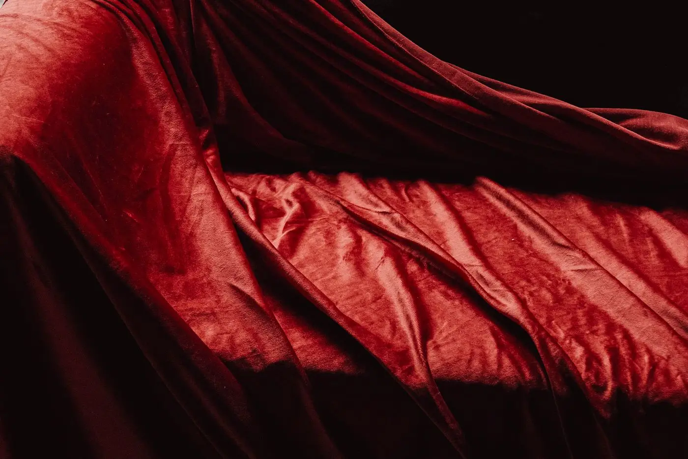 Red stretch velvet draped to catch the light